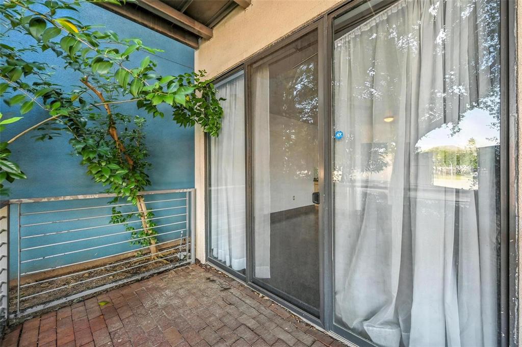 4414 Cedar Springs Road, Unit 124 Dallas, TX 75219 - Photo 16 of 20 a view of a house with a backyard