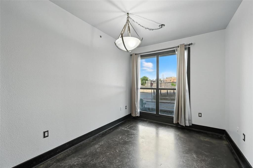 4414 Cedar Springs Road, Unit 124 Dallas, TX 75219 - Photo 6 of 20 a view of a room with wooden floor and windows
