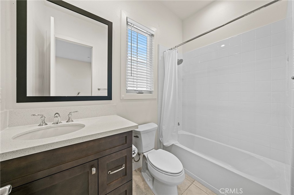 52 Eider Run Irvine, CA 92618 - Photo 45 of 46 a bathroom with a toilet a sink a mirror a bathtub and vanity