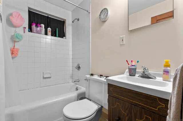 a bedroom with bed and a window