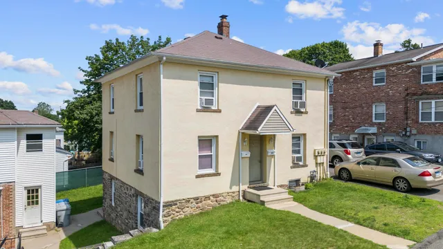 a front view of a house with a yard