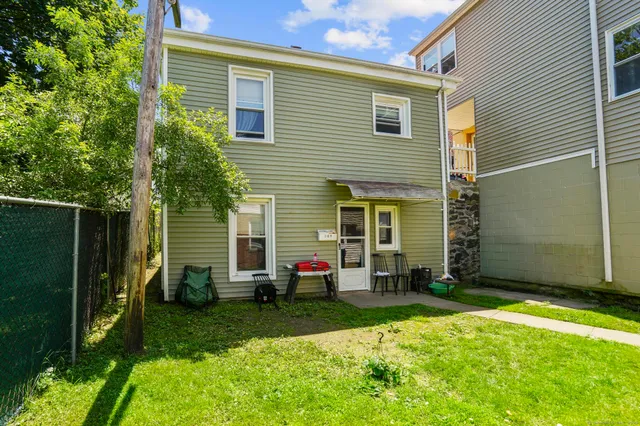 a view of backyard with a garden and entertaining space