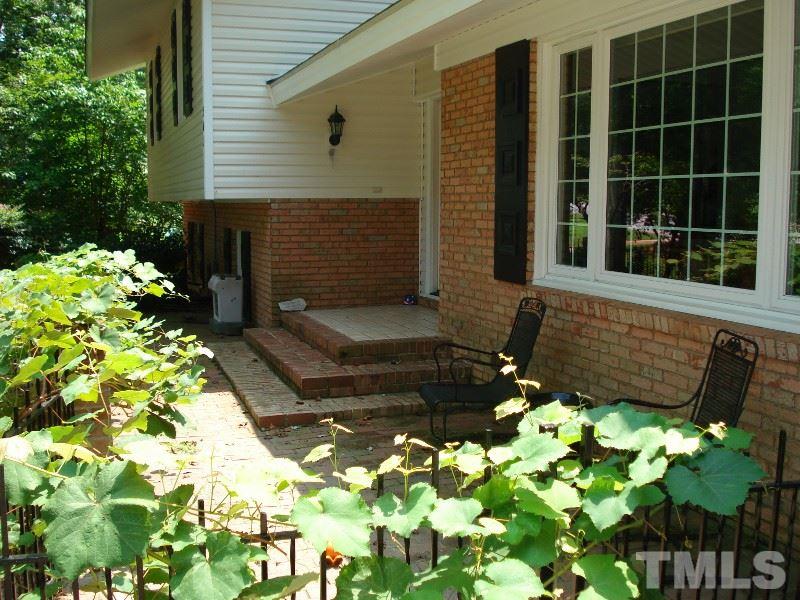 505 Roxanne Drive Raleigh, NC 27603 - Photo 2 of 25 a front view of a house with a yard