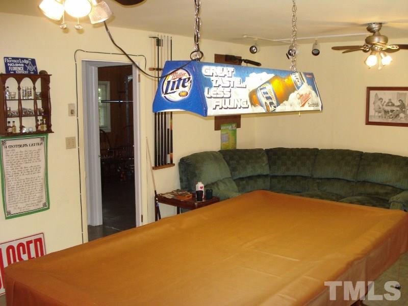 505 Roxanne Drive Raleigh, NC 27603 - Photo 12 of 25 a view of a room with kitchen and chandelier