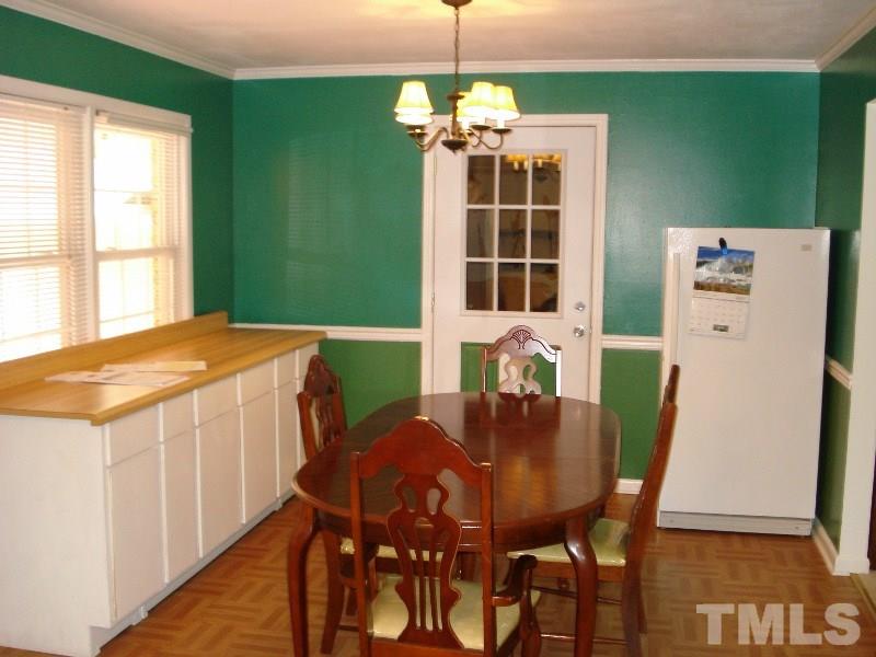 505 Roxanne Drive Raleigh, NC 27603 - Photo 16 of 25 a dining room with furniture and window