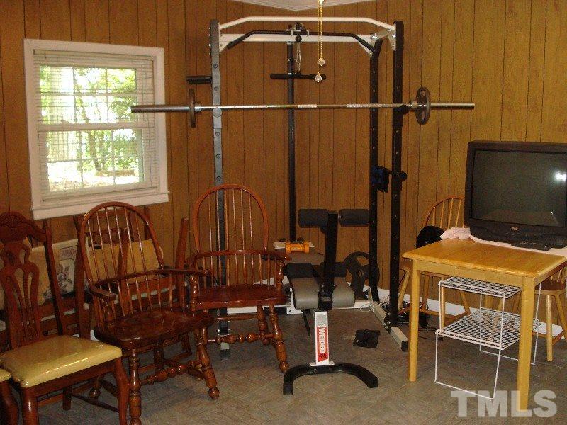 505 Roxanne Drive Raleigh, NC 27603 - Photo 20 of 25 a view of a room with gym equipment