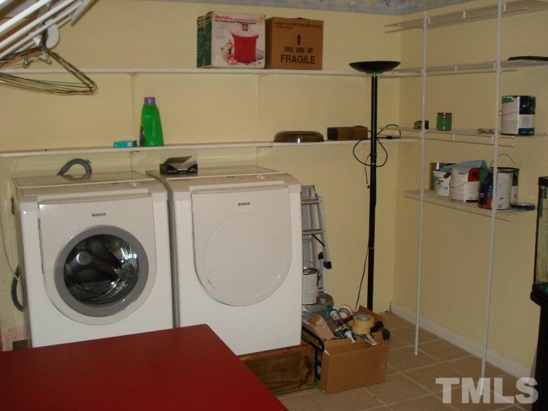 505 Roxanne Drive Raleigh, NC 27603 - Photo 21 of 25 a utility room with dryer and washer