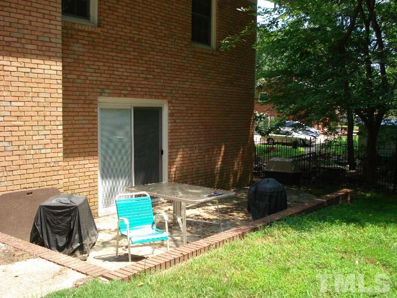 505 Roxanne Drive Raleigh, NC 27603 - Photo 10 of 25 a view of a brick house with a yard