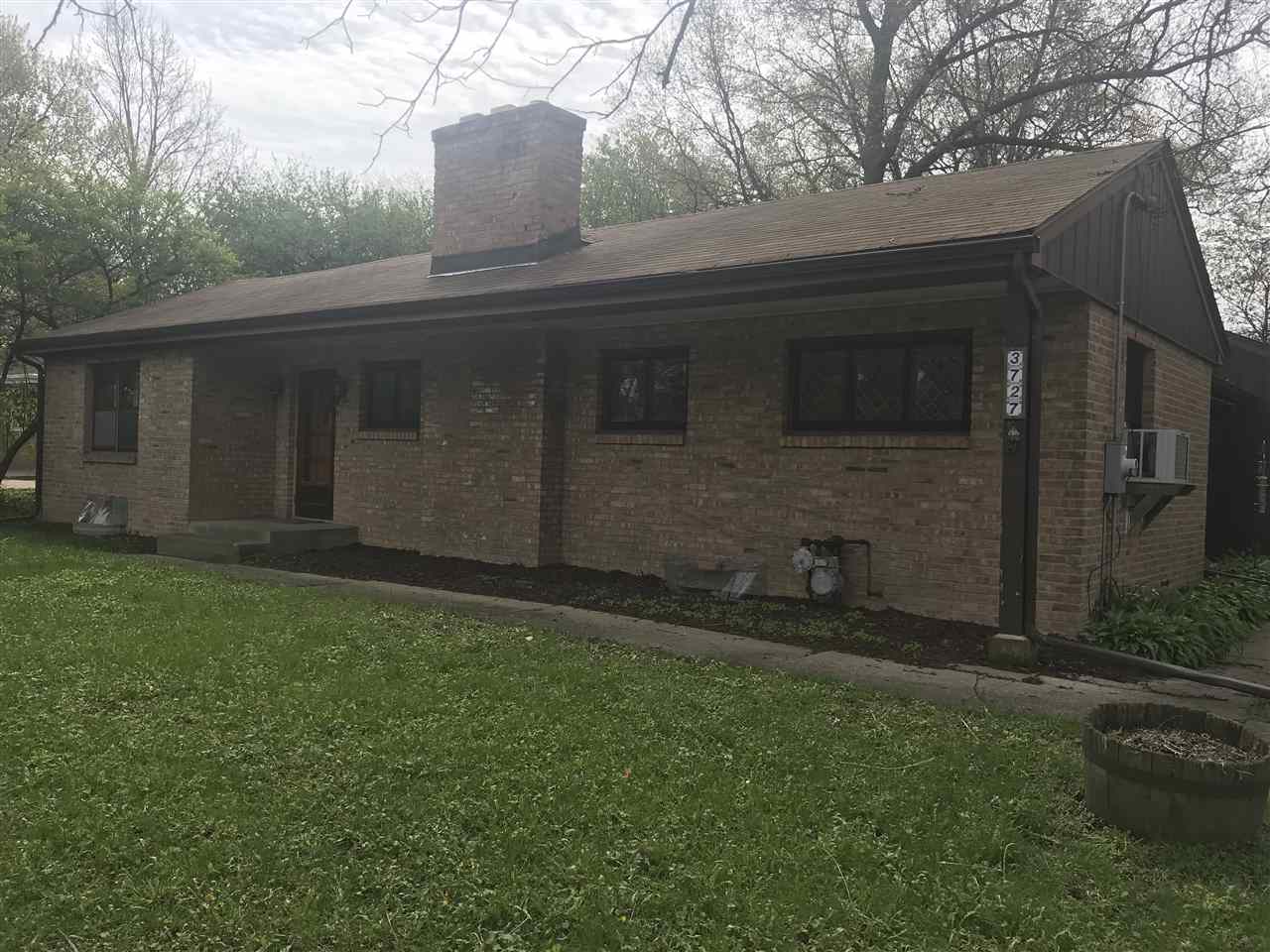 3727 Highcrest Road Rockford, IL 61107 - Photo 2 of 19 a view of back yard of the house