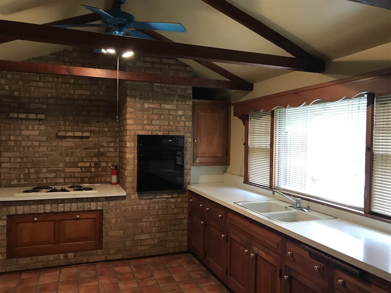 3727 Highcrest Road Rockford, IL 61107 - Photo 4 of 19 a kitchen with stainless steel appliances wooden cabinets and a stove top oven