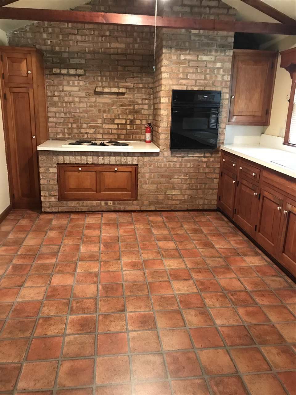 3727 Highcrest Road Rockford, IL 61107 - Photo 6 of 19 a view of a fireplace with wooden floor