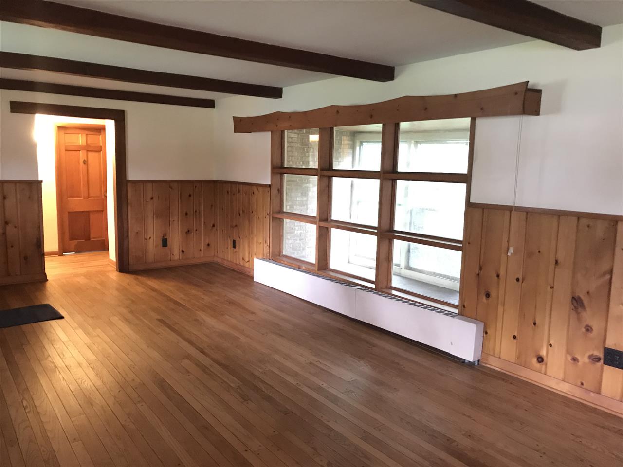 3727 Highcrest Road Rockford, IL 61107 - Photo 8 of 19 a view of empty room with wooden floor and fan