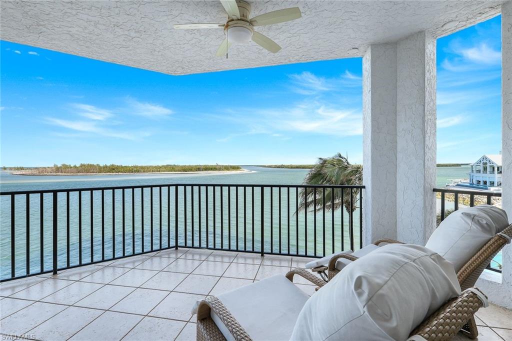 700 La Peninsula Boulevard, Unit 305 Naples, FL 34113 - Photo 18 of 39 a balcony with a bed