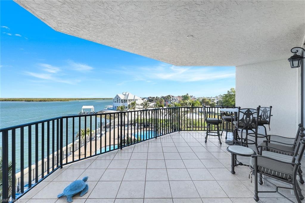 700 La Peninsula Boulevard, Unit 305 Naples, FL 34113 - Photo 30 of 39 a view of balcony with furniture