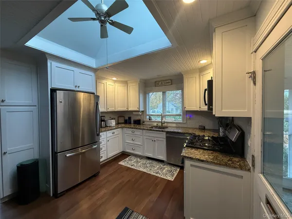 a kitchen with a refrigerator a sink and dishwasher