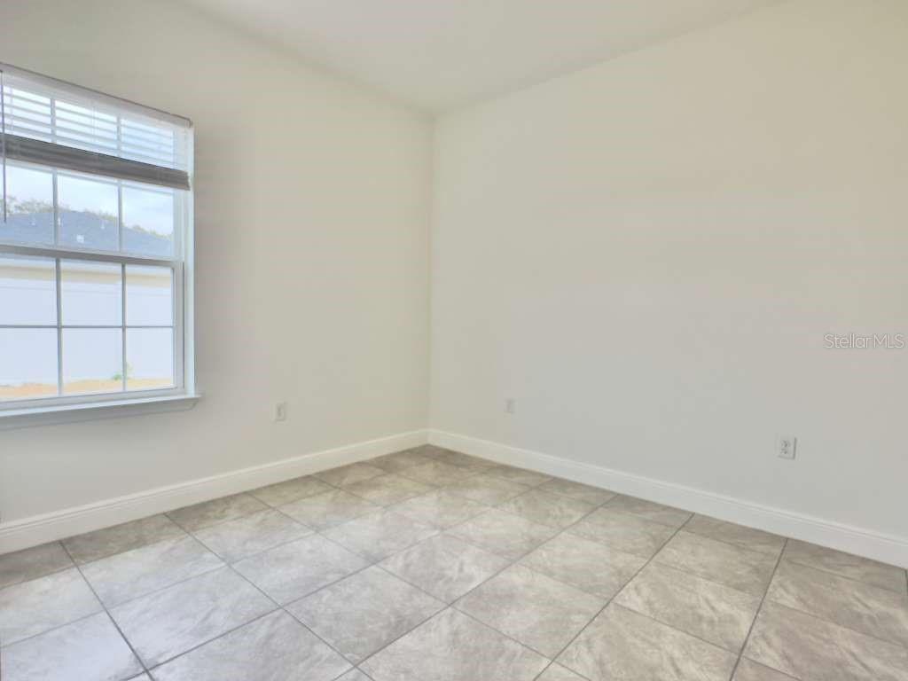 15885 Southwest 35th Court Road, Unit 1 Ocala, FL 34473 - Photo 15 of 27 an empty room with a window