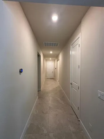 a view of hallway with livingroom