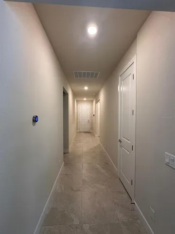 a view of hallway with livingroom