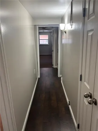 a bathroom with a bathtub and a window