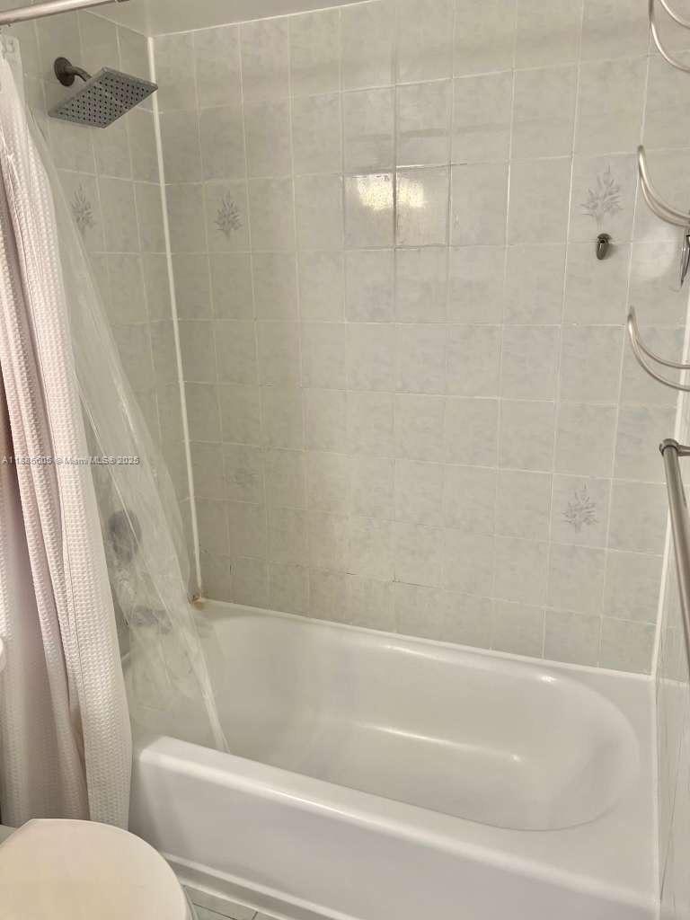 1300 West 53rd Street, Unit 18 Hialeah, FL 33012 - Photo 4 of 16 a bathroom with a bathtub and a shower