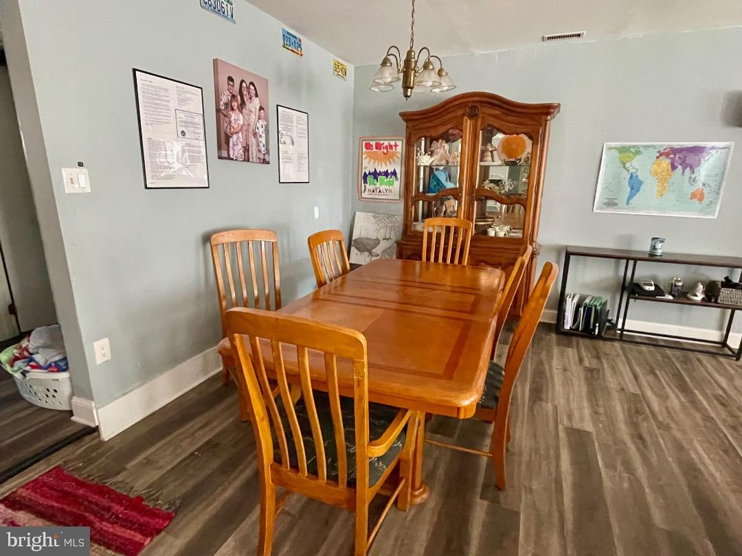 904-906 Main Avenue Croydon, PA 19021 - Photo 13 of 51 a view of a dining room with furniture a chandelier and wooden floor