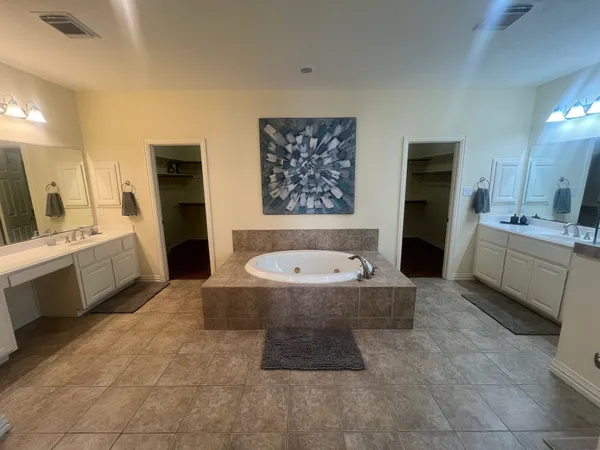 a bathroom with a bathtub sink and toilet