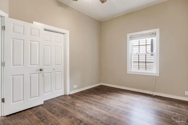 a view of a house with wooden walls
