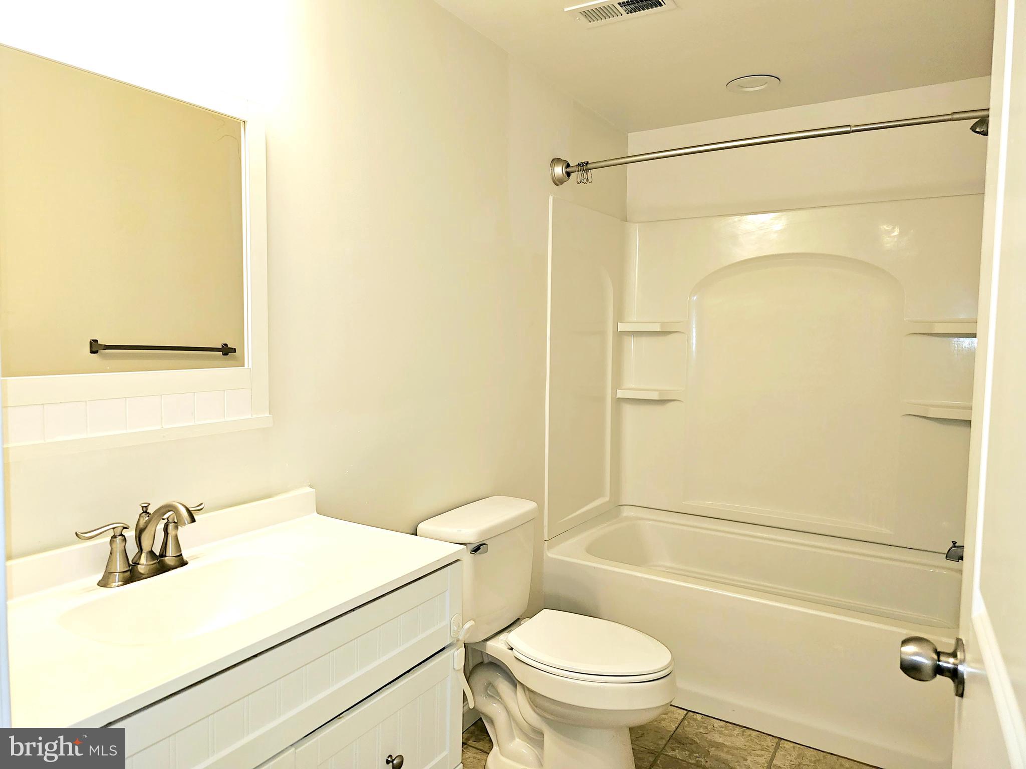 143 Mitscher Road Dover, DE 19901 - Photo 16 of 25 a bathroom with a sink toilet and shower