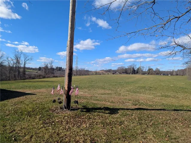 a view of a road with an ocean view