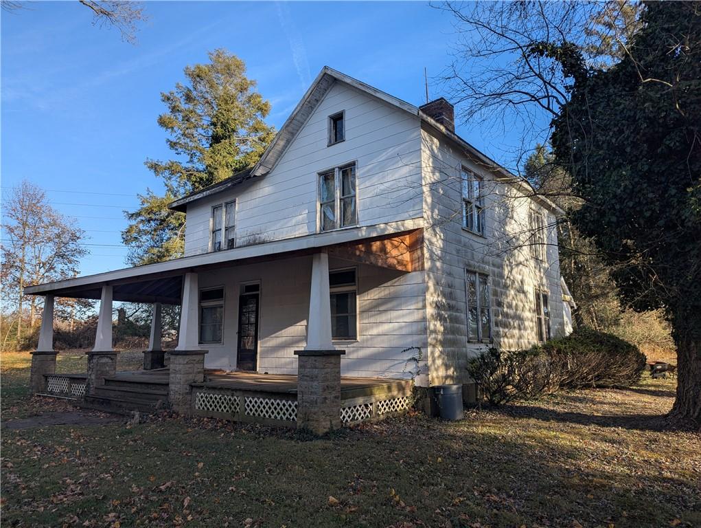 315 Telegraph Road Brownsville, PA 15417 - Photo 2 of 31 a front view of a house with garden