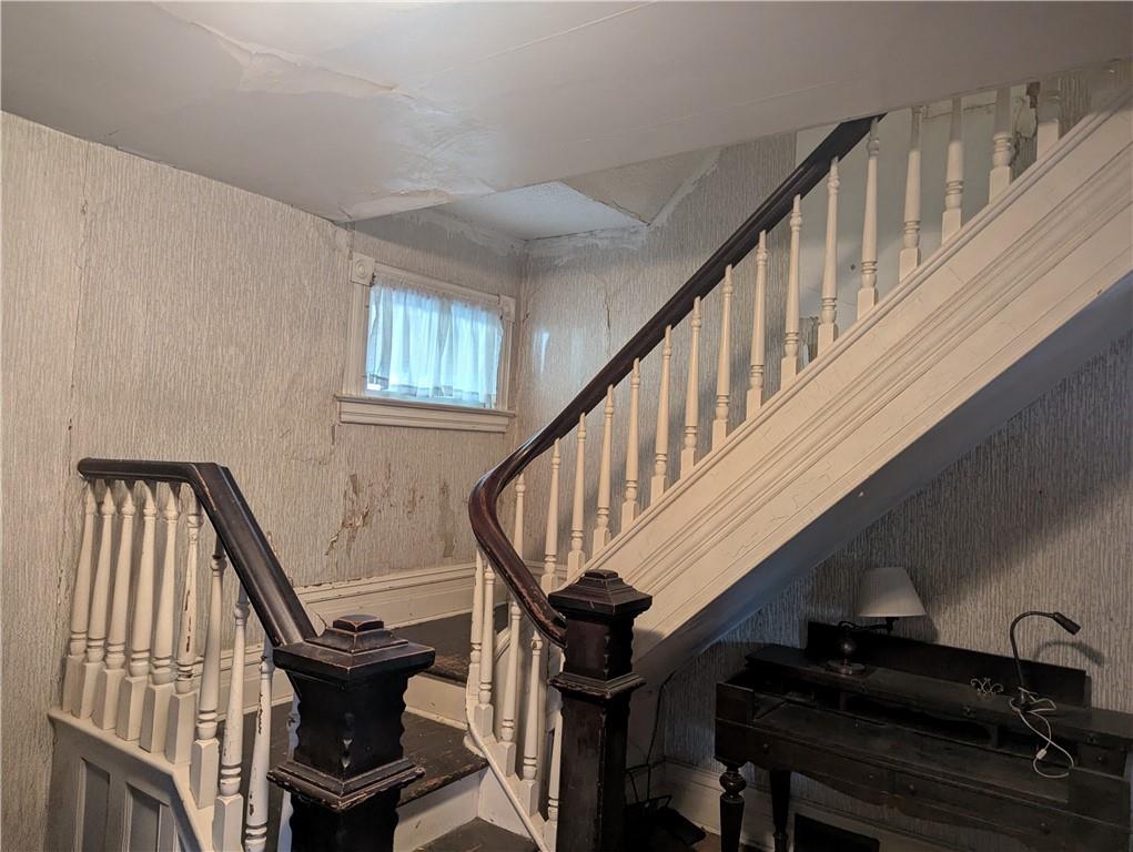 315 Telegraph Road Brownsville, PA 15417 - Photo 4 of 31 a view of entryway with wooden stairs and wooden floor