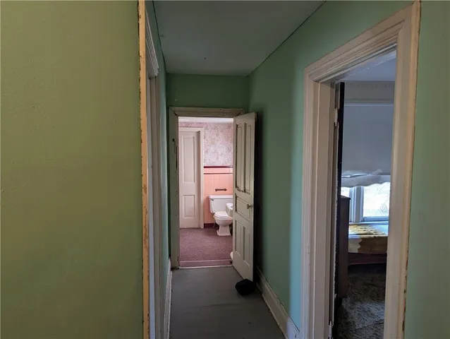a view of a bathroom from a hallway