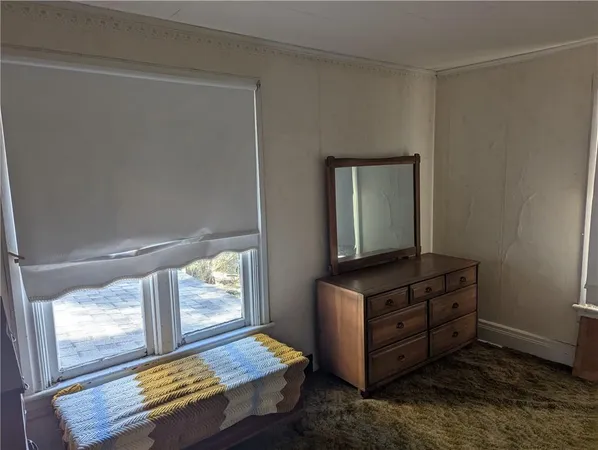 a room with window and mirror