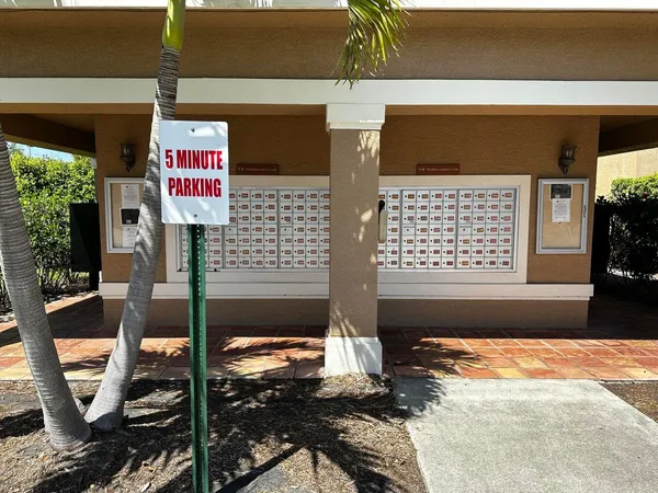 a front view of a house with outdoor seating