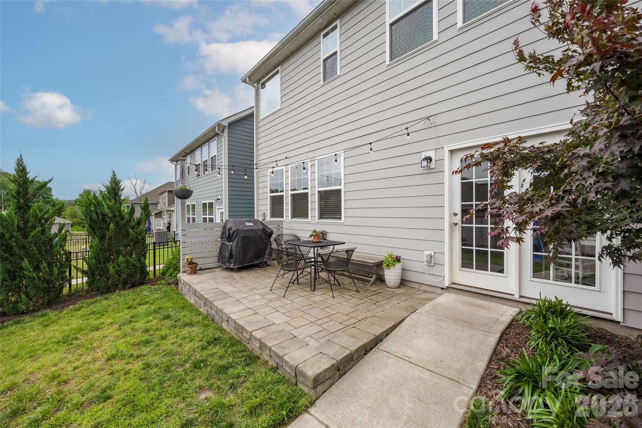 17219 Shearer Road Davidson, NC 28036 - Photo 26 of 34 a view of a patio with table and chairs and potted plants