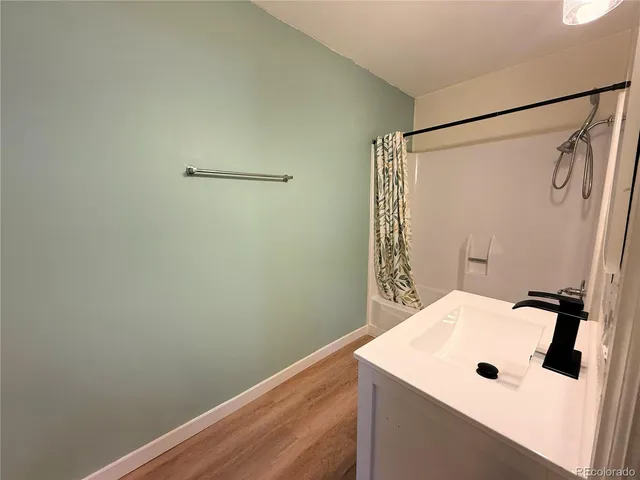 a bathroom with a sink and shower