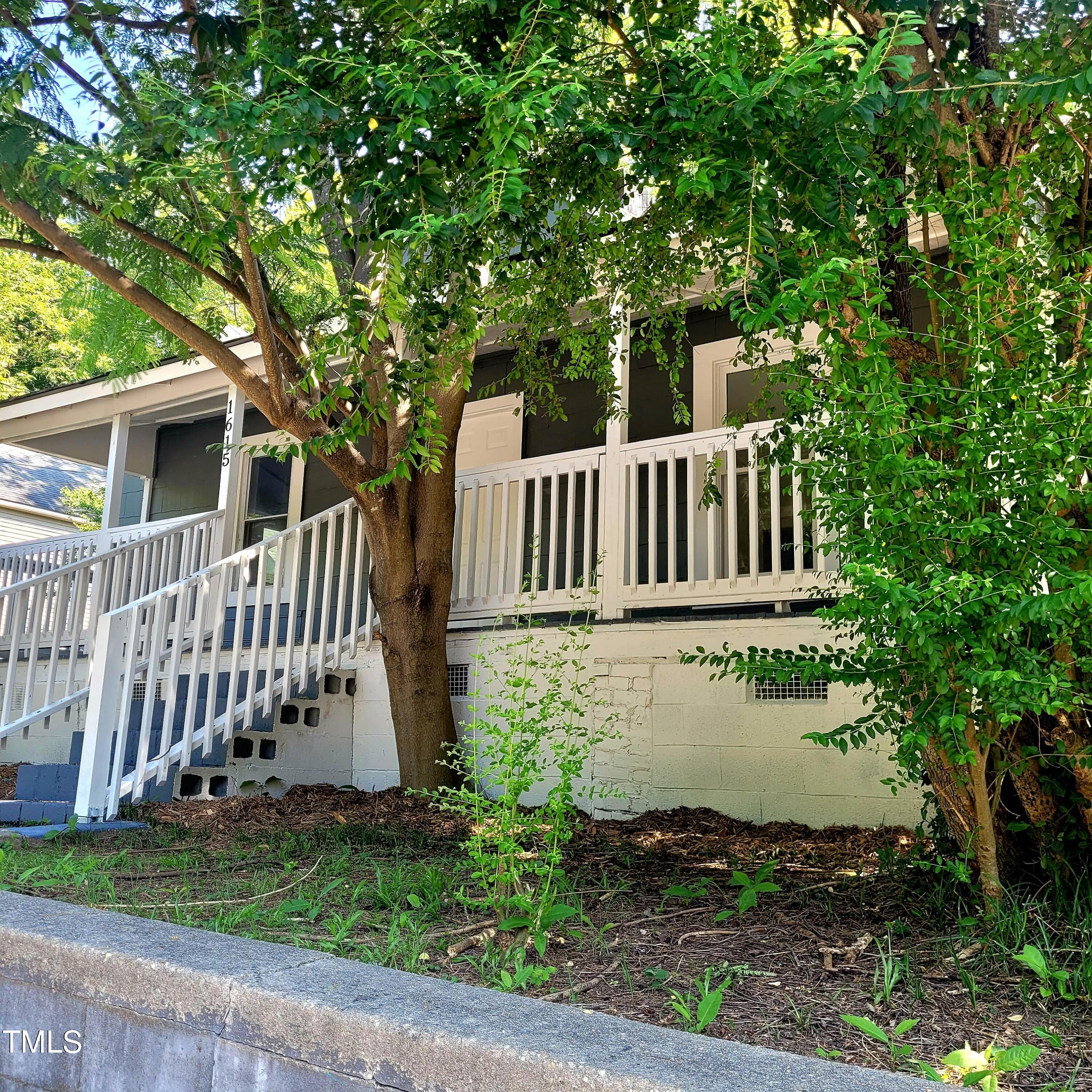 1615 Poole Road Raleigh, NC 27610 - Photo 3 of 14 a view of a deck with a yard