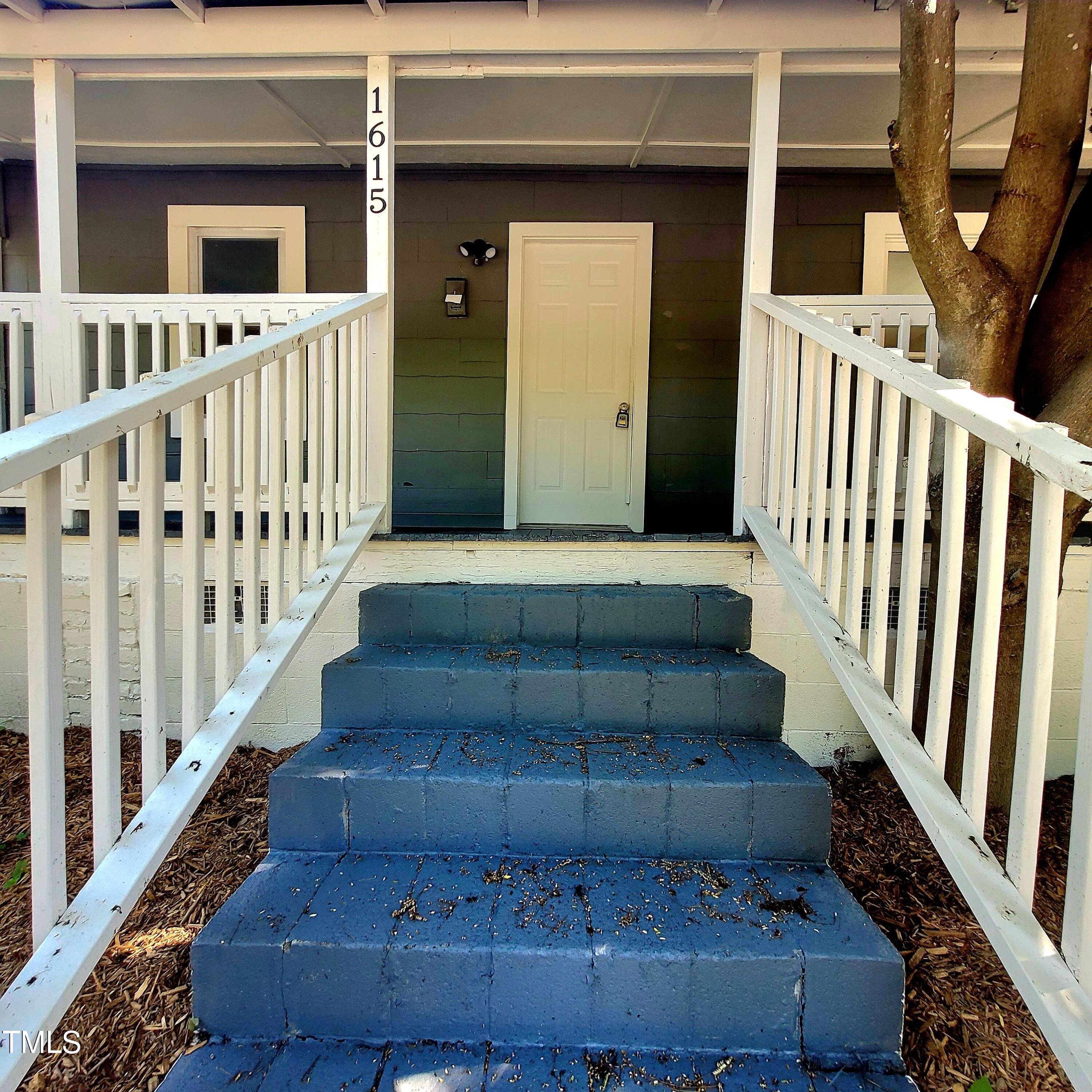 1615 Poole Road Raleigh, NC 27610 - Photo 4 of 14 a view of staircase with white walls and a window