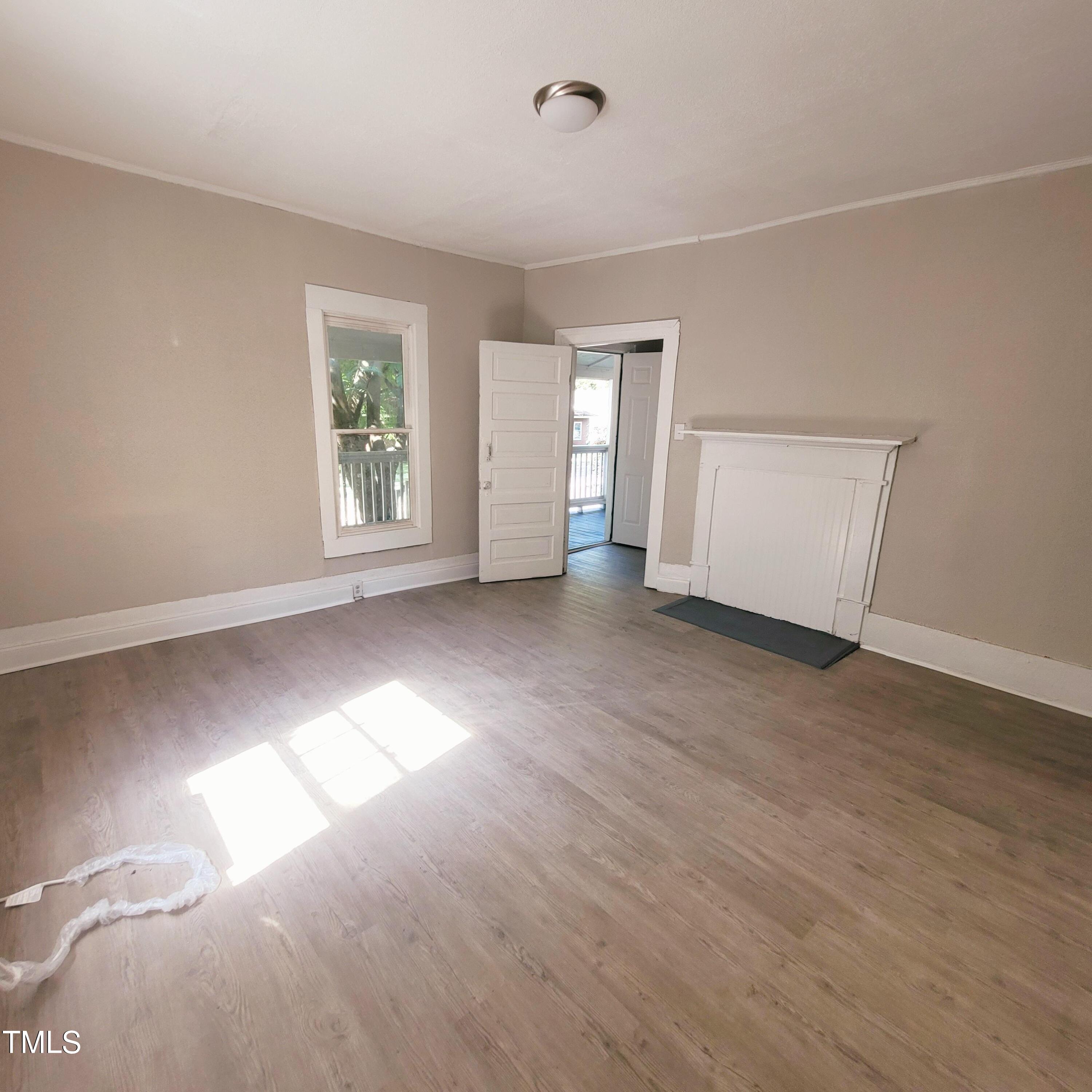 1615 Poole Road Raleigh, NC 27610 - Photo 6 of 14 an empty room with windows and closet