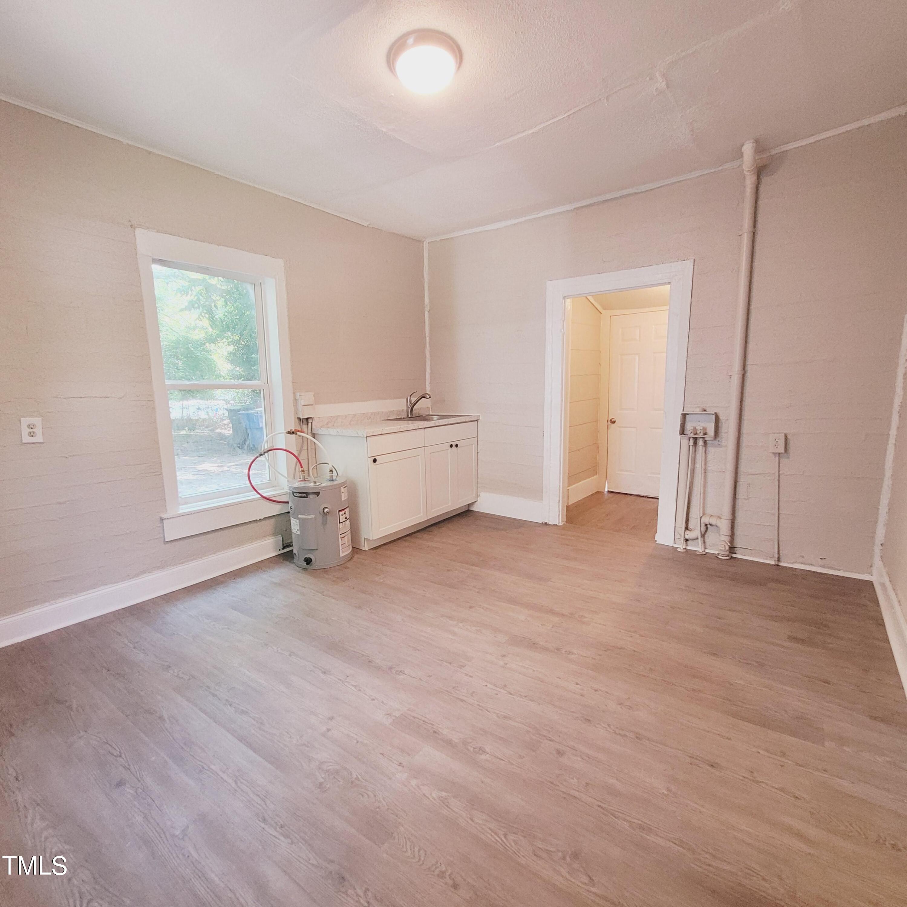 1615 Poole Road Raleigh, NC 27610 - Photo 7 of 14 a living room with furniture and a window