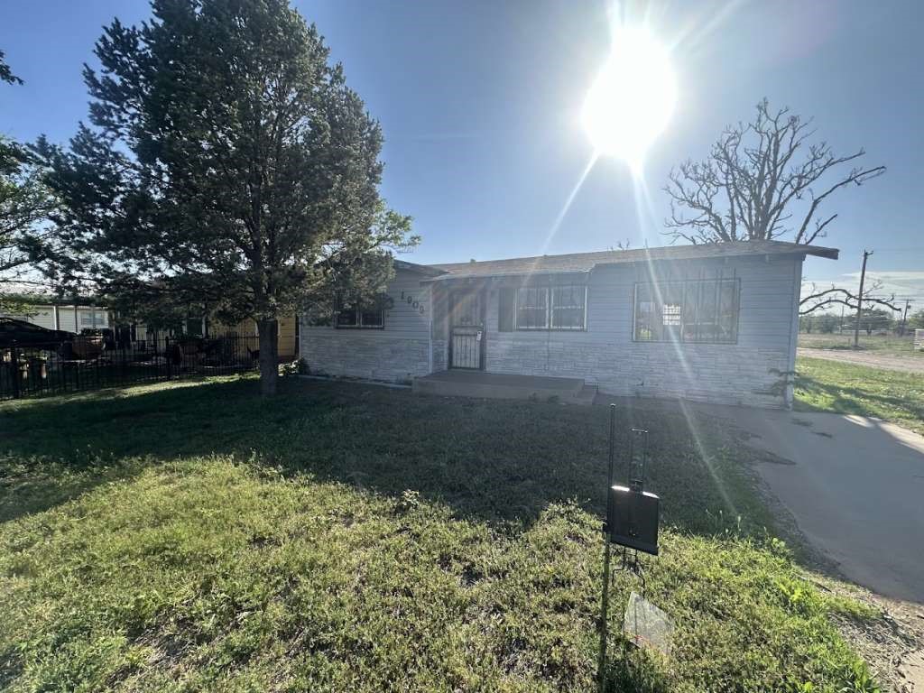 1909 Kokomo Street Plainview, TX 79072 - Photo 1 of 10 a view of a back yard of a house