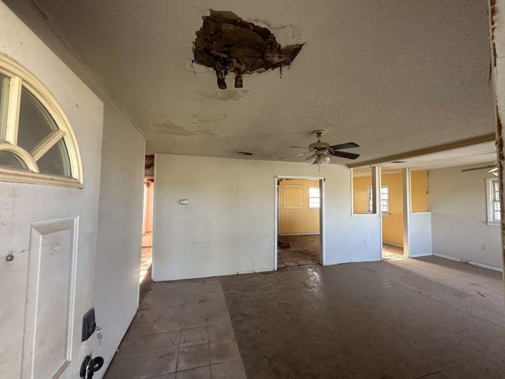 1909 Kokomo Street Plainview, TX 79072 - Photo 3 of 10 a view of a hallway with a window