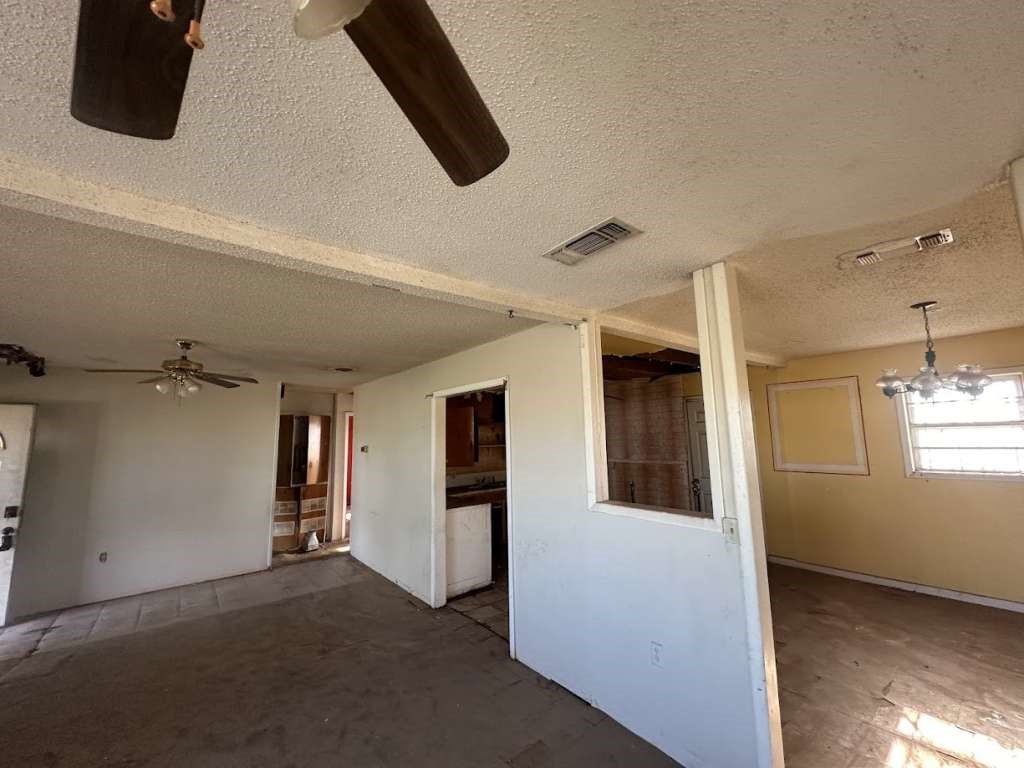 1909 Kokomo Street Plainview, TX 79072 - Photo 6 of 10 a view of a hallway with closet and mirror