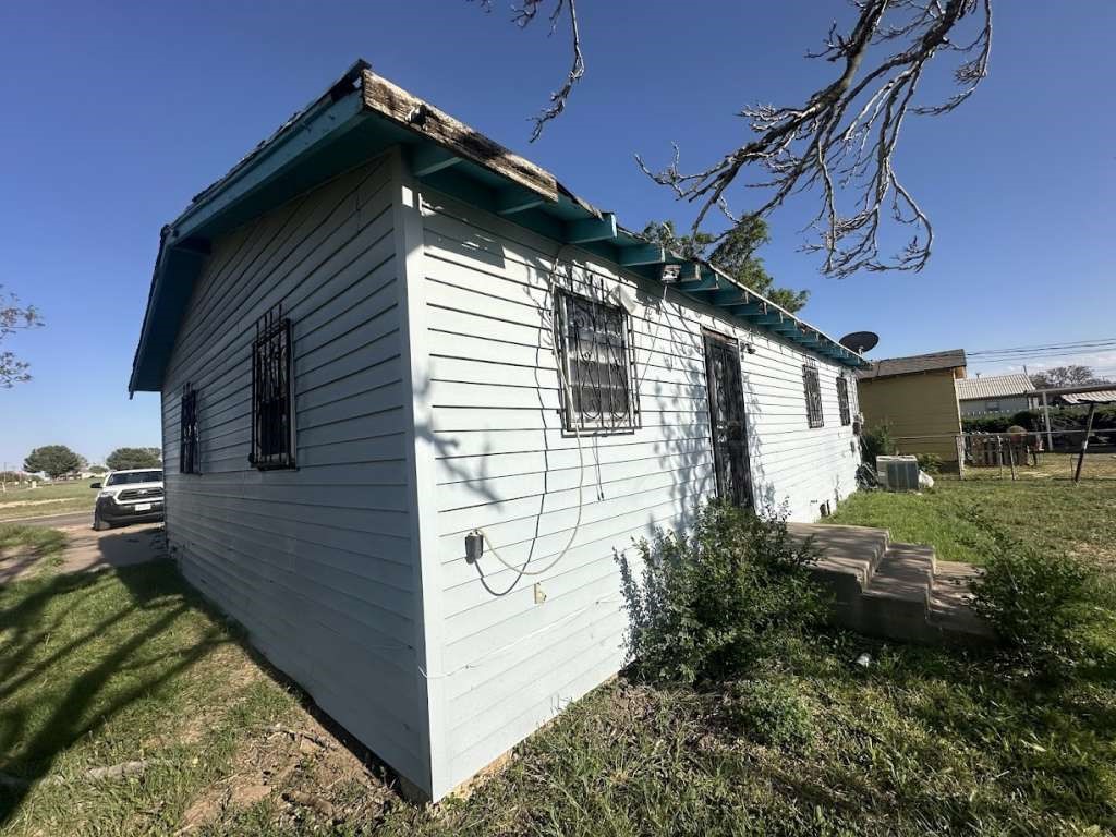 1909 Kokomo Street Plainview, TX 79072 - Photo 8 of 10 a view of a house with a yard