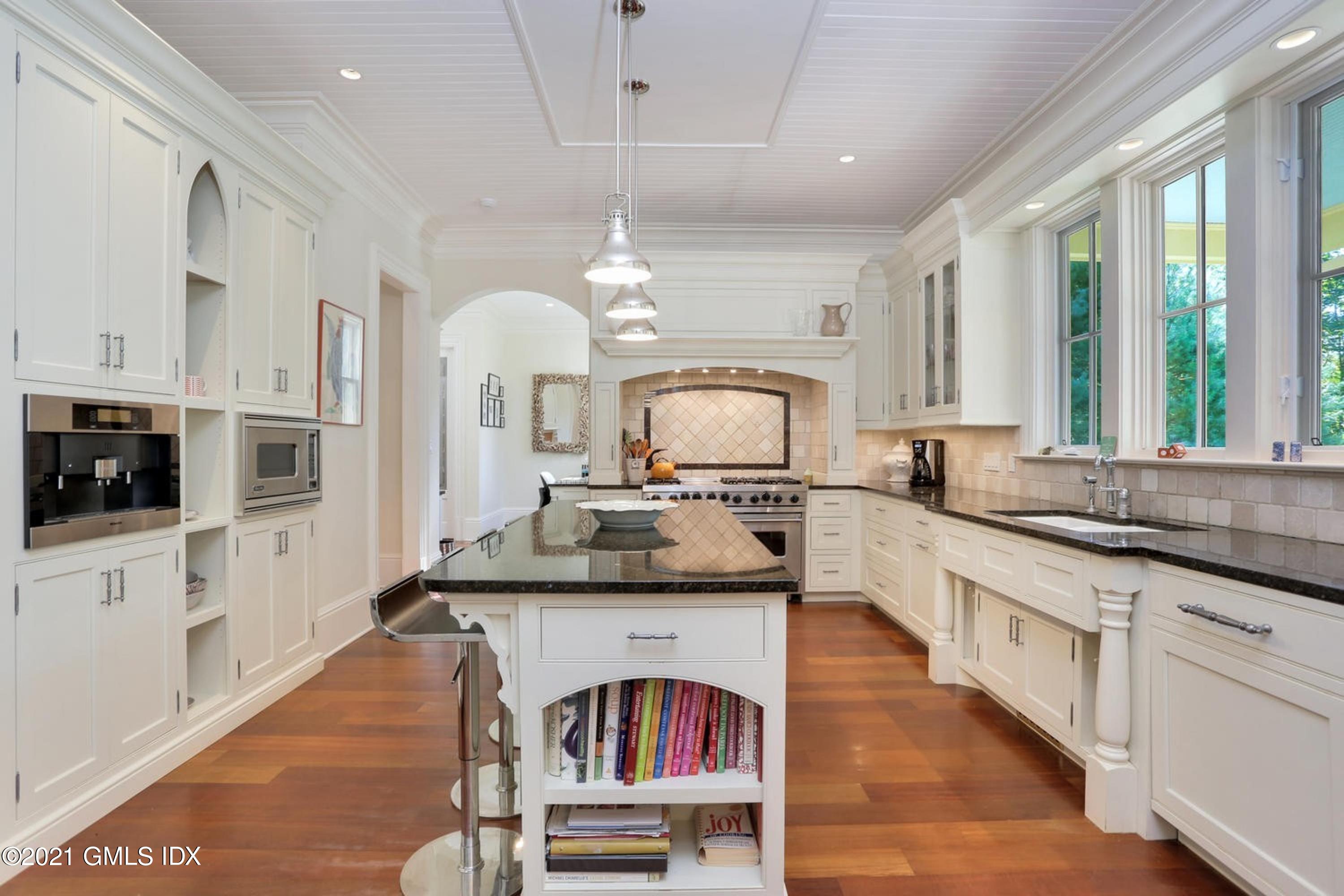 477 Riversville Road Greenwich, CT 06831 - Photo 12 of 33 a large kitchen with stainless steel appliances granite countertop a stove and a sink