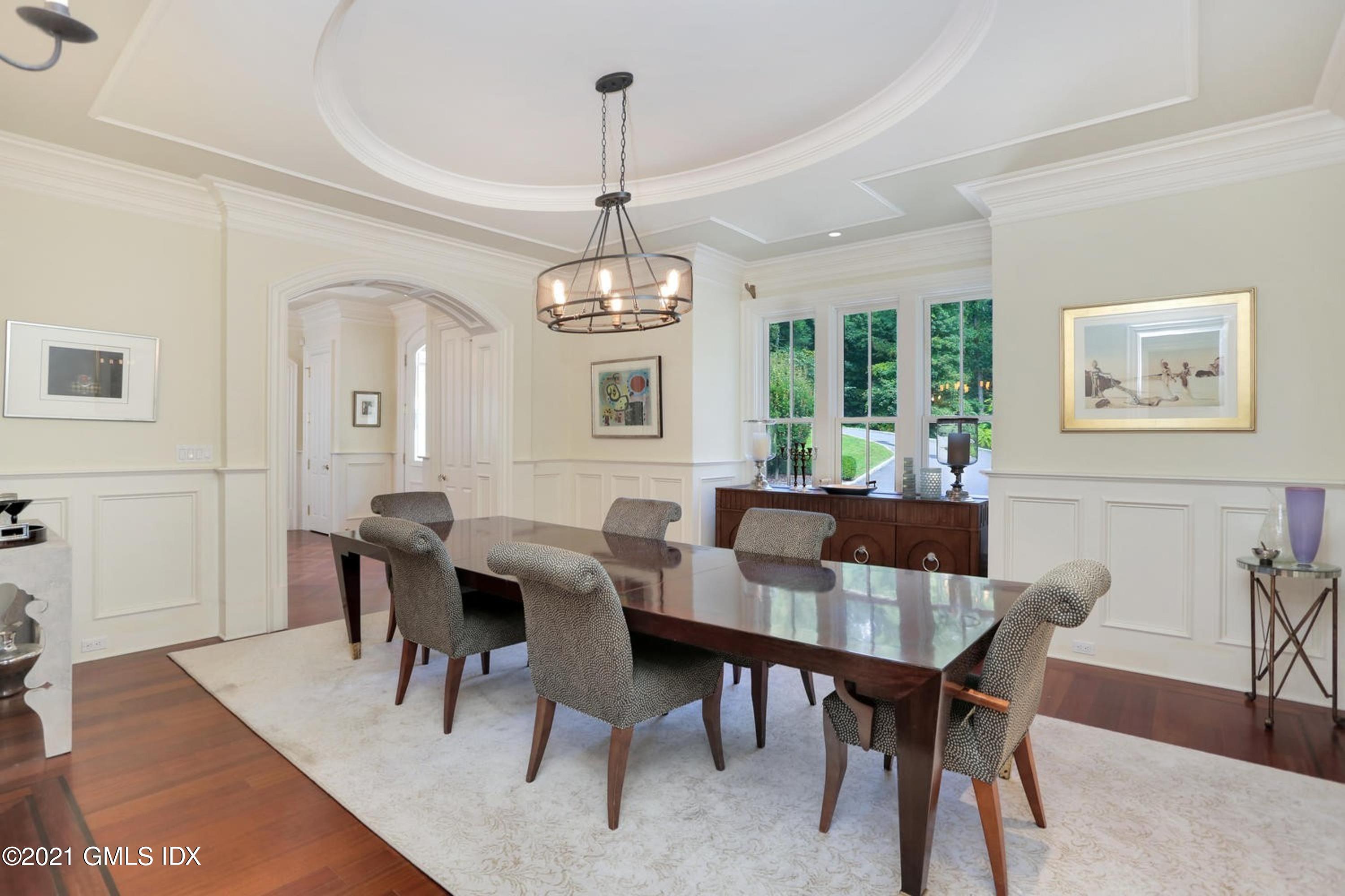 477 Riversville Road Greenwich, CT 06831 - Photo 13 of 33 a view of a dining room with furniture window and wooden floor