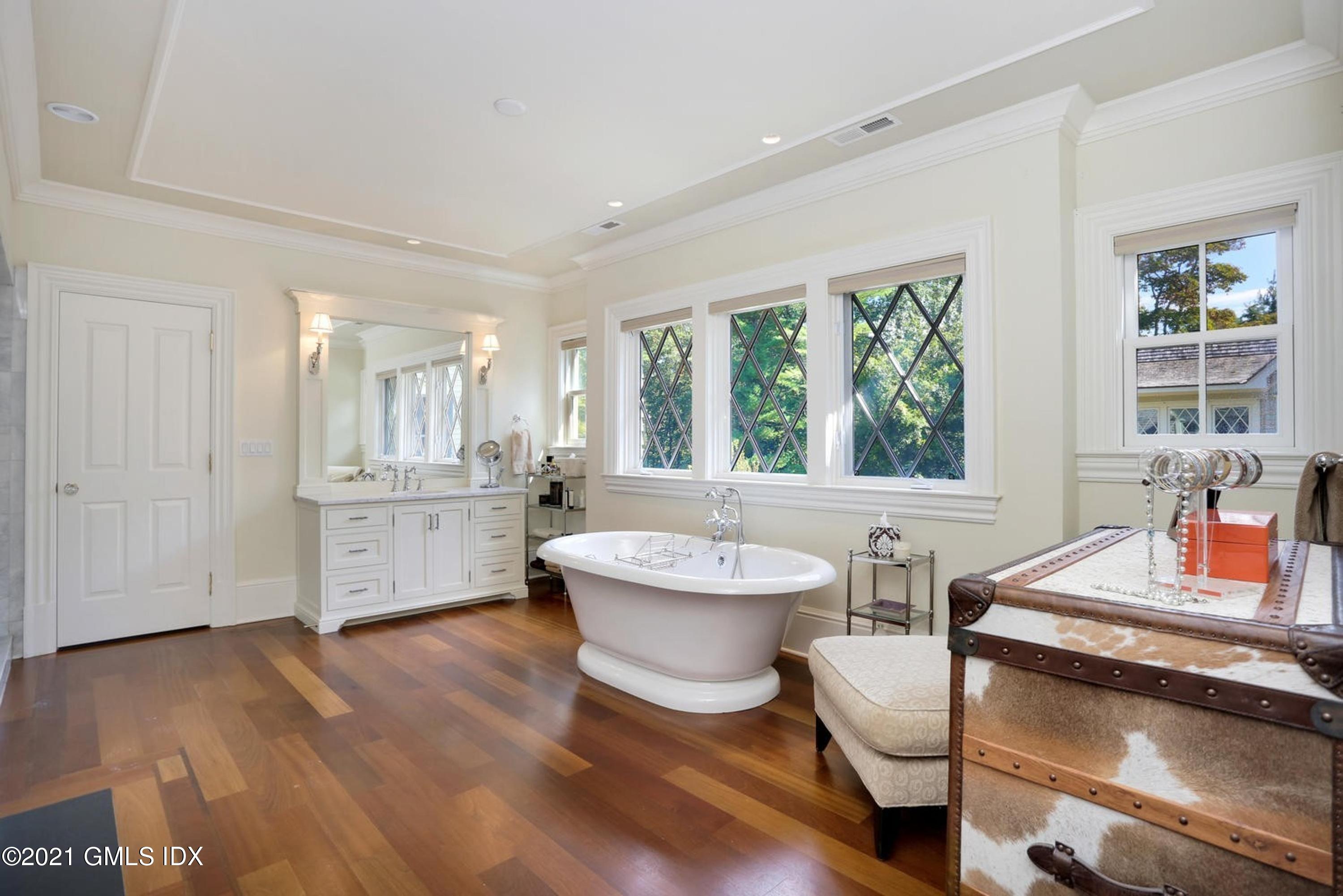 477 Riversville Road Greenwich, CT 06831 - Photo 17 of 33 a bathroom with a granite countertop sink and a large mirror