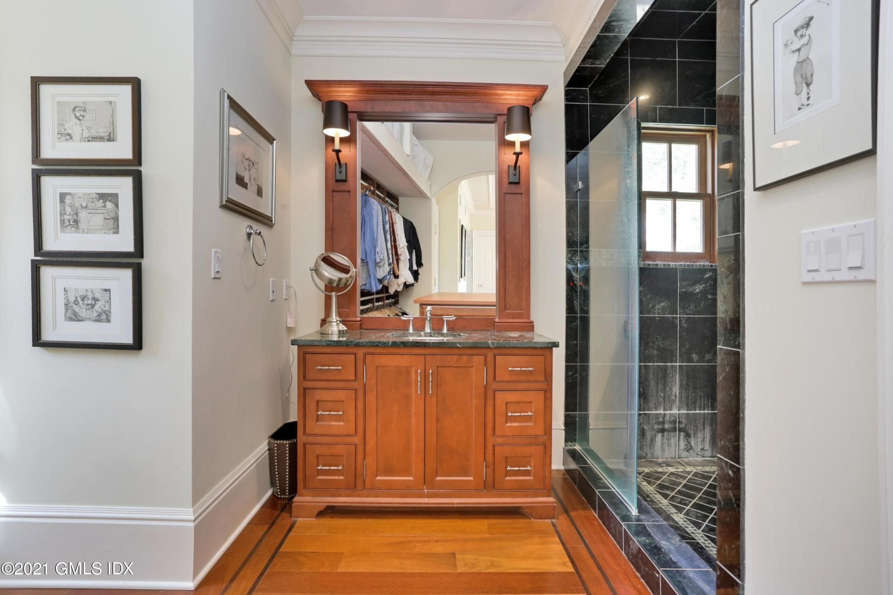 477 Riversville Road Greenwich, CT 06831 - Photo 18 of 33 a bathroom with a bathtub and a shower