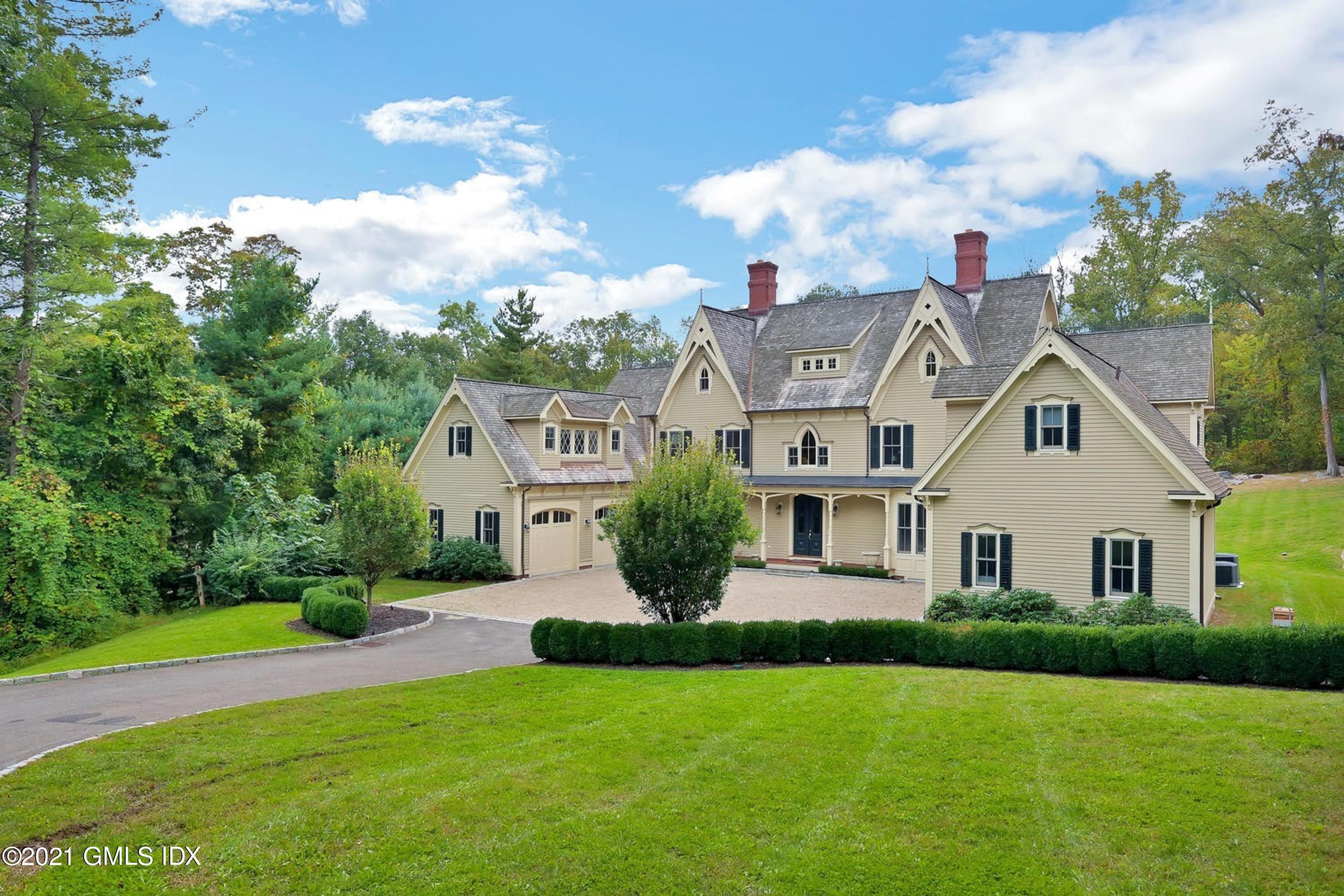 477 Riversville Road Greenwich, CT 06831 - Photo 2 of 33 a front view of a house with a yard