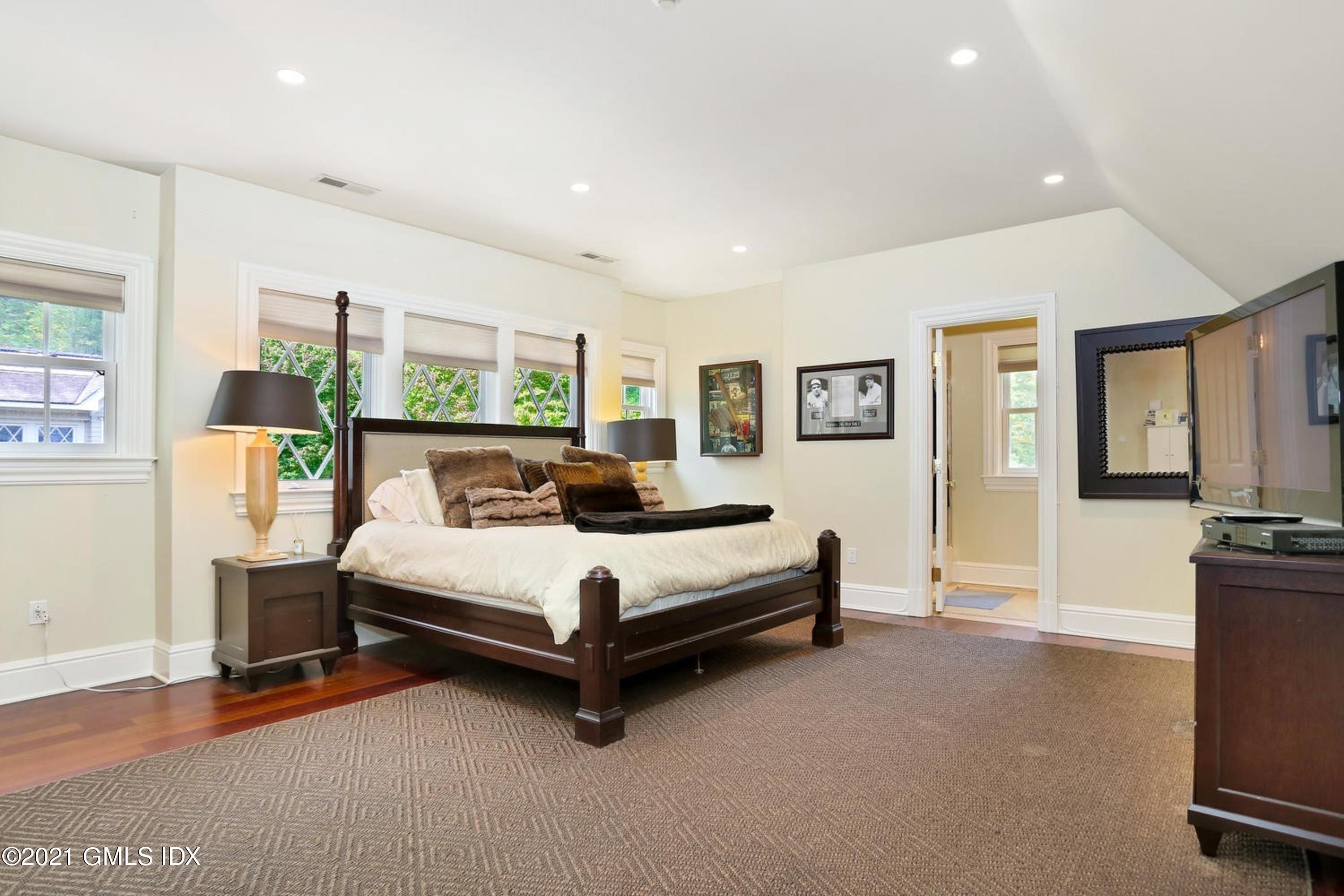 477 Riversville Road Greenwich, CT 06831 - Photo 22 of 33 a living room with furniture and a flat screen tv